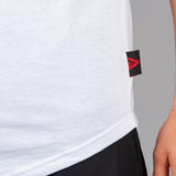 Close up of Legacy tag on men's white t-shirt.