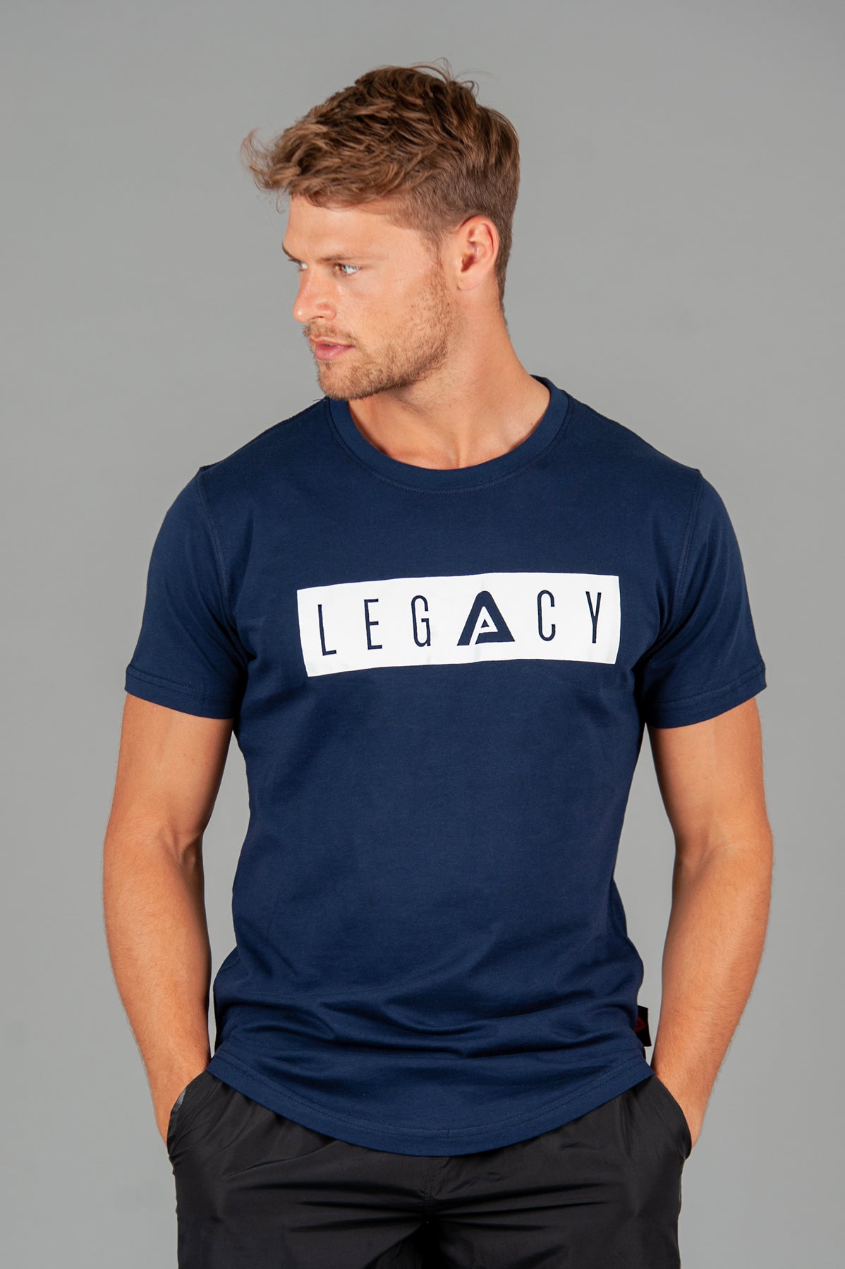 Men's navy t-shirt with white boxed Legacy logo across chest. 
