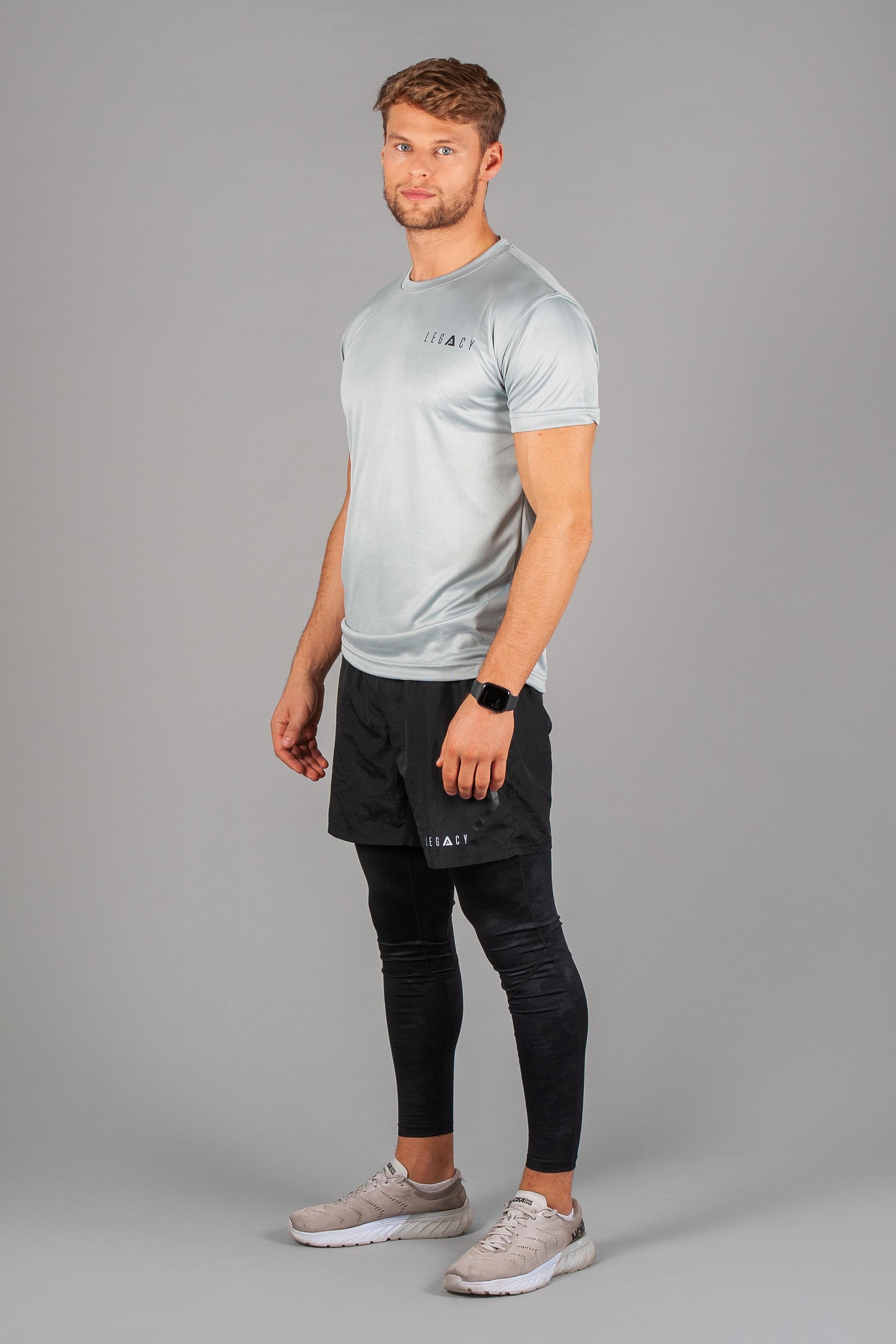 Men's silver moisture wicking crewneck t-shirt with black logo.
