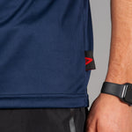Close up of fabric on men's navy moisture wicking t-shirt.