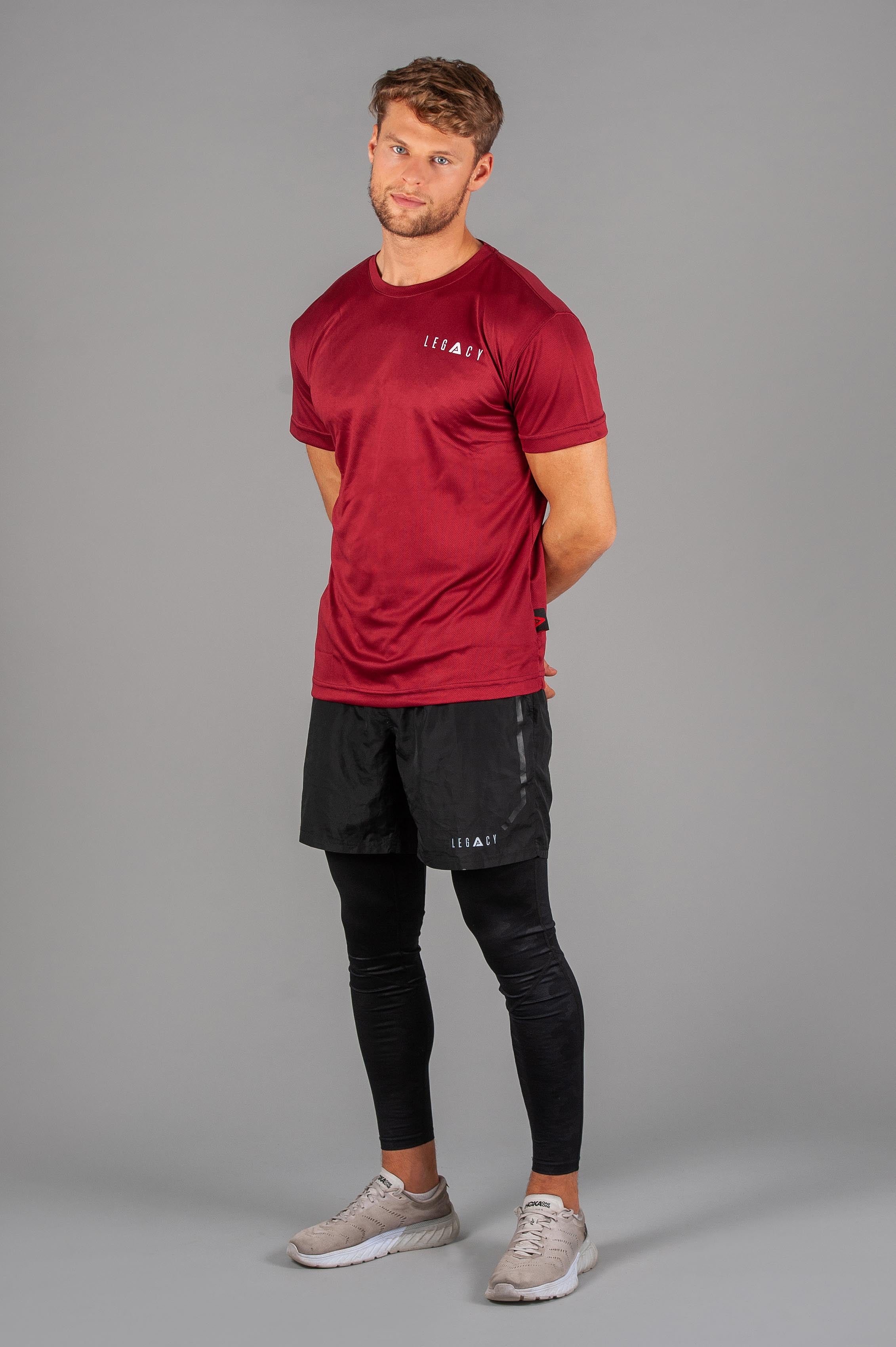 Men's burgundy moisture wicking crewneck t-shirt with white logo.