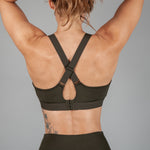 Women's olive sports bra with cross-over adjustable straps and clasp back.